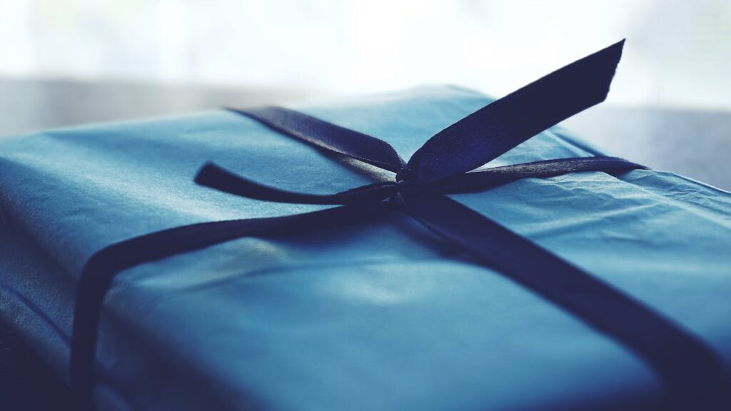 Close-up Photo of Tied Blue Box